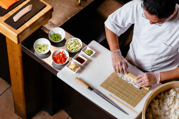 Wall Mural - the process of wrapping sushi.top view shot. copy space