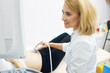 © alfa27 - positive medical worker using sonographic instrument. close up side view photo.