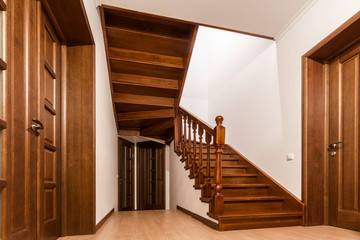 Canvas Print - Modern brown oak wooden stairs  and doors in new renovated house interior