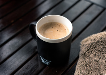 hands in a hot cup of coffee