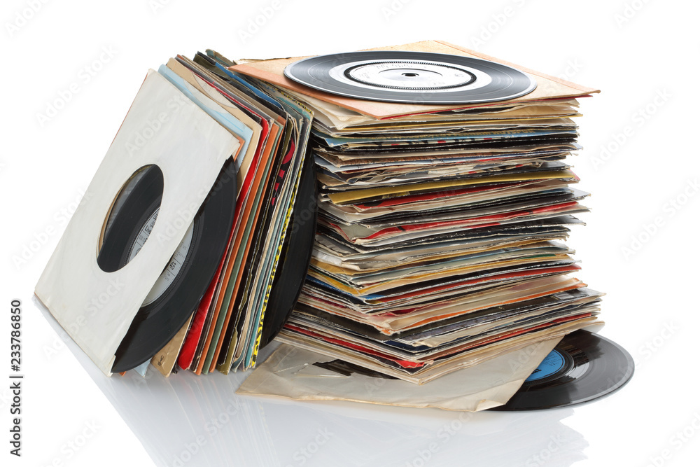 Pile of retro vinyl 45rpm singles records - obrazy, fototapety, plakaty 