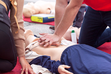 Wall Mural - First aid training using automated external defibrillator device - AED