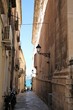 Narrow alley in the old Town Ortigia Syracuse, Sicily Italy 