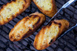 © Andrew Scrivani - Close up of toast bread on barbecue grill