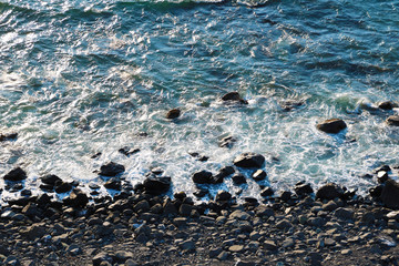 Wall Mural - Ocean landscape background, water with waves and rock, ocean view from above, coastline