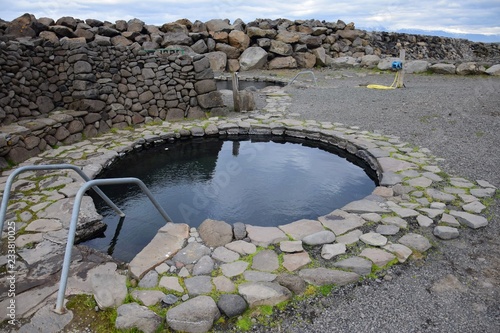Fotomural The hot pot Grettislaug on peninsula Skagi in Iceland.