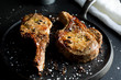 © Andrew Scrivani - Close up of baked pork chops in a pan