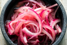 Close Up Of Pickled Red Onion In Bowl