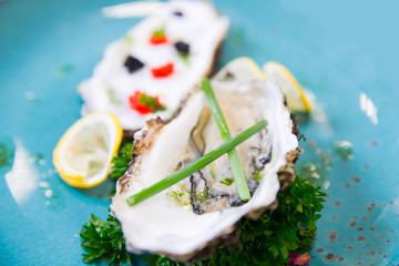 Fresh oysters with red and black caviar