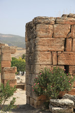 Ancient Greek Ruins At Hierapolis, Anatolia, Turkey With Remnants Of Old Buildings Made With Blocks Of Stone In A Close Up View In A Rural Landscape