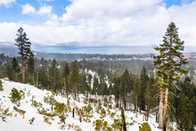 Cloudy Spring Day With Snow Covering The Sierra Mountains, Lake Tahoe In The Background; Van Sickle Bi-State Park; California And Nevada