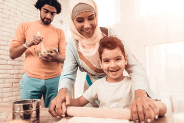 Poster - Happy Arabian Family Cooking Food in Kitchen.