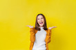 Asian girl is surprised she is excited.Yellow background studio