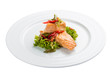 Fillet of baked salmon with salad. On a white background