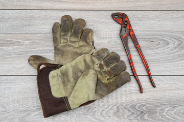 Wall Mural - a parrot key and a pair of work gloves on a wooden table