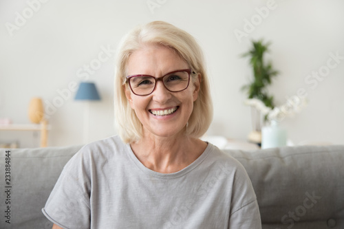 Smiling Middle Aged Mature Grey Haired Woman Looking At Camera