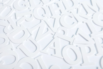white wooden alphabet letters top view on white background