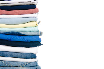 Wall Mural - A stack of clothes jeans t-shirt shirt on a white background. Isolation