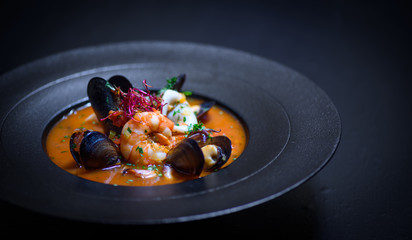 Delicious mediterranean seafood soup with mussels and prawns