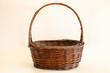 empty wicker basket on soft light background / copy space