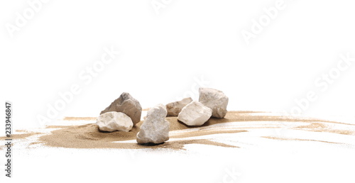 Fototapeta Rocks in sand pile isolated on white background and texture