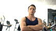© motortion - Professional muscular personal trainer posing, gym service, sport motivation