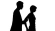 © motortion - Male holding female, stopping from walking away during conversation, crisis