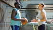 © motortion - Trainer and basketball player talking about future game, active lifestyle