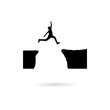 Black Silhouette of man jumping over mountains icon or logo