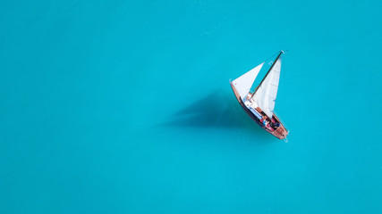 Wall Mural - yacht on the water surface from top view. turquoise water background from top view. summer seascape 