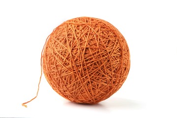 Orange big thread ball isolated on white background. Ball of natural cotton string.