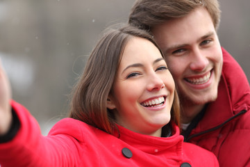 Poster - Happy couple with perfect smile taking selfies