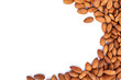 heap almonds top view frame or border on white background.