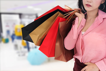 Sticker - woman holding shopping bag at mall