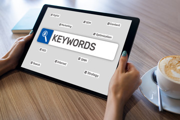 keywords. seo, search engine optimization and internet marketing concept on screen.