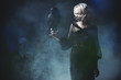 © Andrey Kiselev - holding black raven