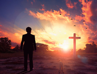Canvas Print - Thanksgiving concept: a businessman standing in front of the cross