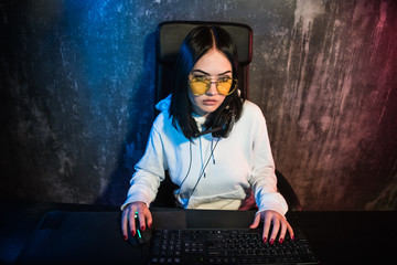 Portrait of the Beautiful Young Girl Sitting Before Computer, Browsing in Internet, Studying, Playing Online Games, Streaming.