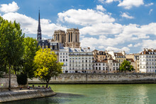 The Two Towers Of Notre Dame De Paris Church In France Seen From Louis Philippe Bridge On The Seine On A Summer Day