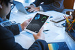 © ordinary042 - Business people discussing in meeting room using tablet for checking graph finance.  Teamwork successful Meeting Workplace strategy Concept.