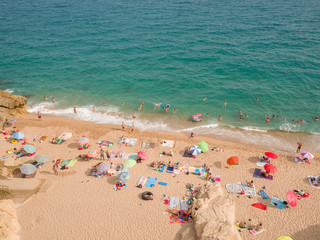 People at beach in Calella city. Spain.