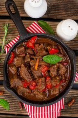 Wall Mural - Beef stew with bell pepper, tomatoes and red wine