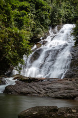 Wall Mural - Beautiful waterfall flowing through a tropical rain forest in Thailand (Ton Prai, Lam Ru, Thailand)