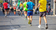 © Rawf8 - Marathon running race, runners running on city roads