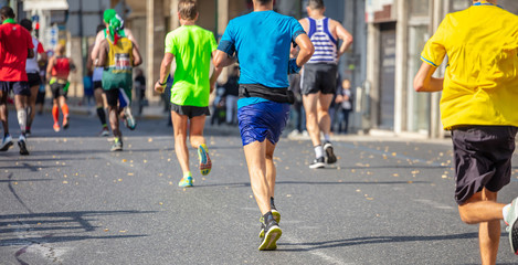 Wall Mural - Marathon running race, runners running on city roads