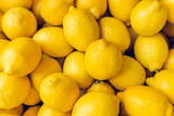 Ripe Yellow Lemons Close-up Background Or Texture. Lemon Harvest, Many Yellow Lemons.
