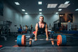 Male weightlifter prepares to pull heavy barbell