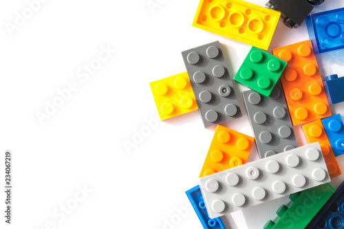Plastic building blocks isolated on white background. Free space for inscript...
