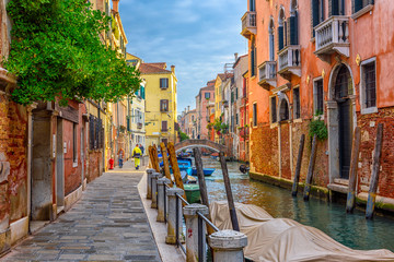 Wall Mural - Narrow canal with bridge in Venice, Italy. Architecture and landmark of Venice. Cozy cityscape of Venice.