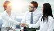© ASDF - handshake of manager and client in the office lobby